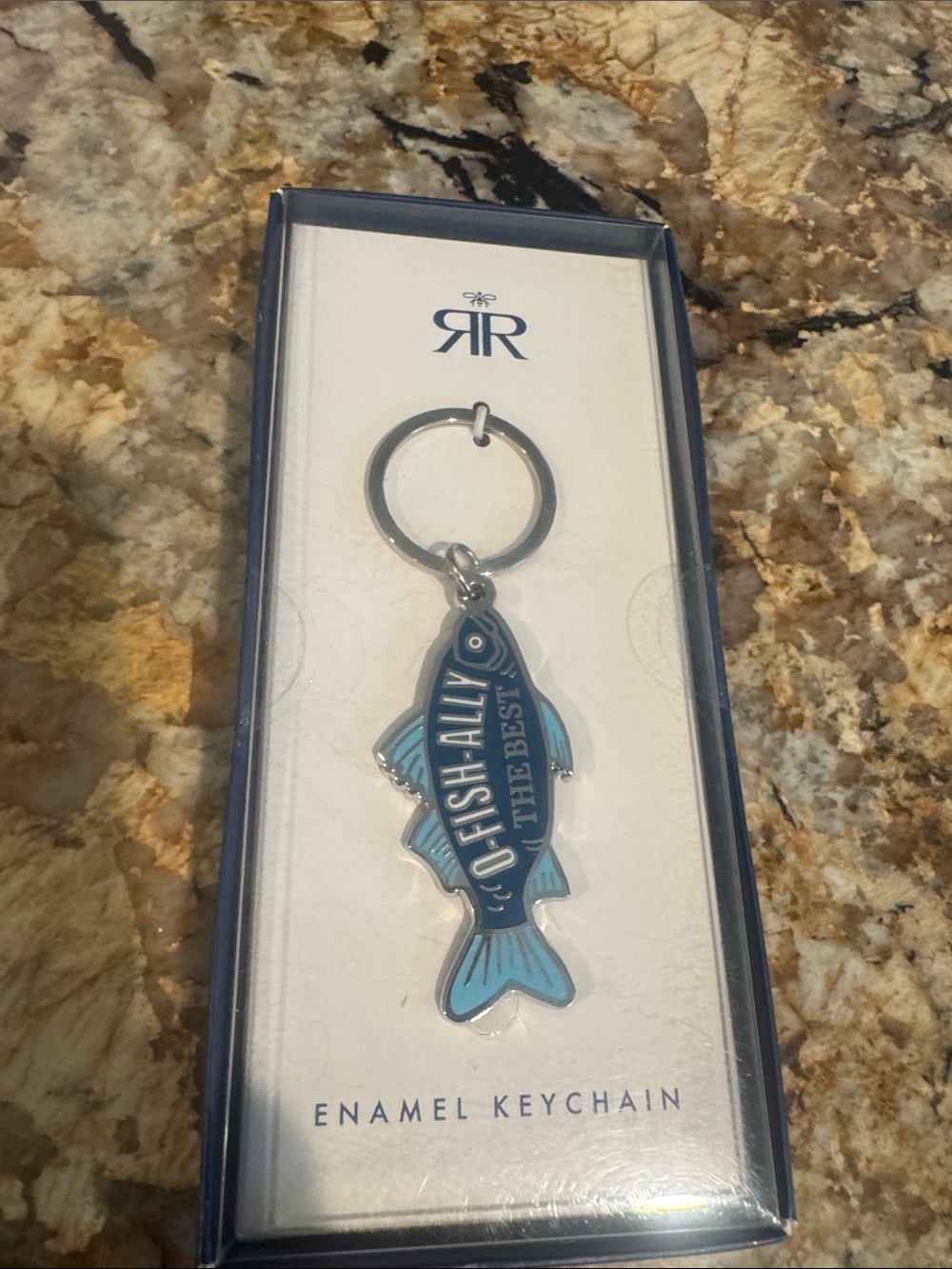 Roberts & Reid Blue Enamel Fish Keychain says “ O-Fish-Ally The Best”!